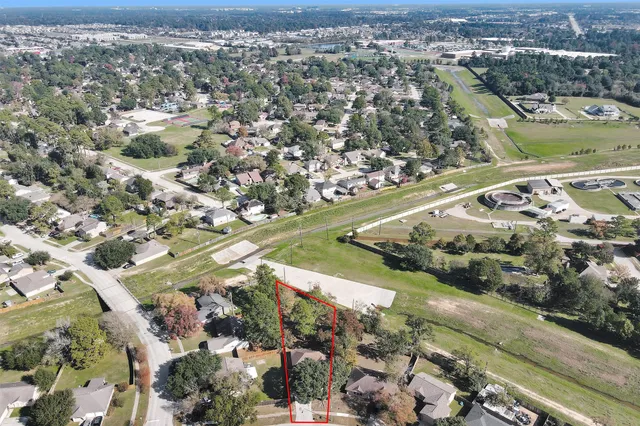 an aerial view of residential houses with outdoor space