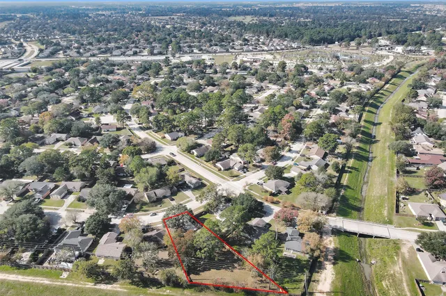 an aerial view of residential houses with outdoor space