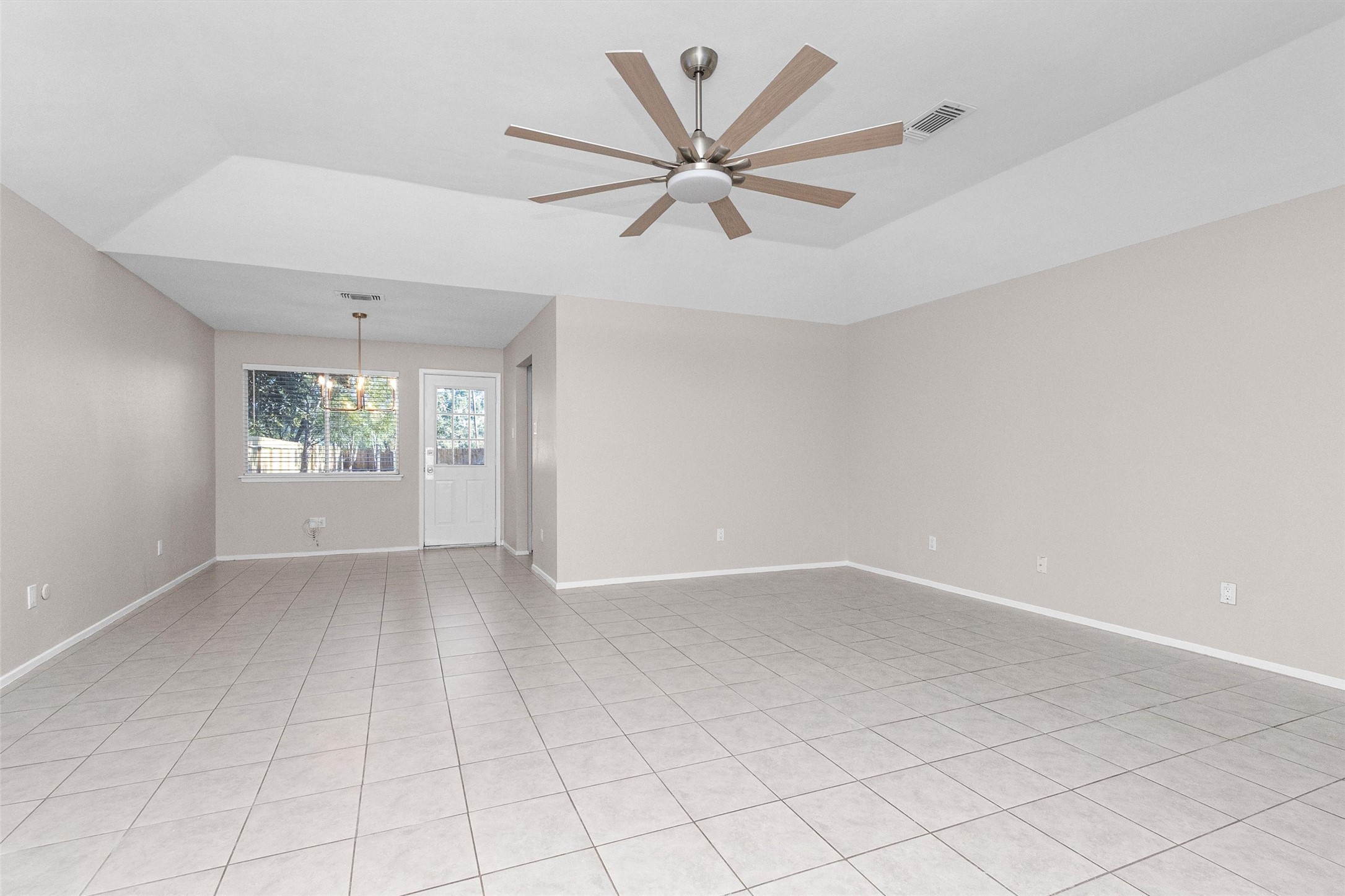 21030 Rivershadows Lane Spring, TX 77388 - Photo 7 of 38 an empty room with windows and fan