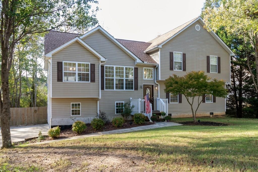 81 Stable Lane Dallas, GA 30132 - Photo 1 of 1 a front view of a house with a yard