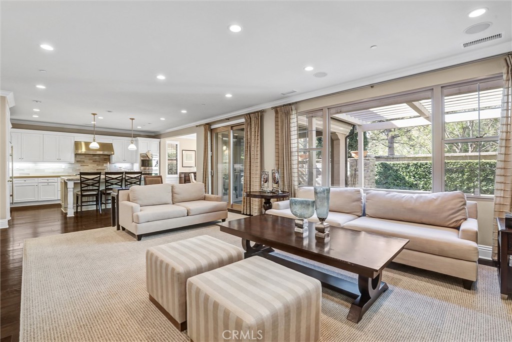 59 Rossmore Irvine, CA 92620 - Photo 11 of 45 a living room with furniture and large windows