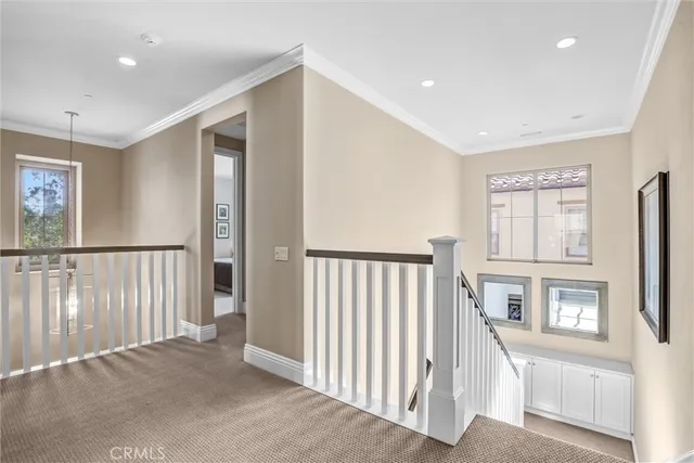 a view of a hallway with windows