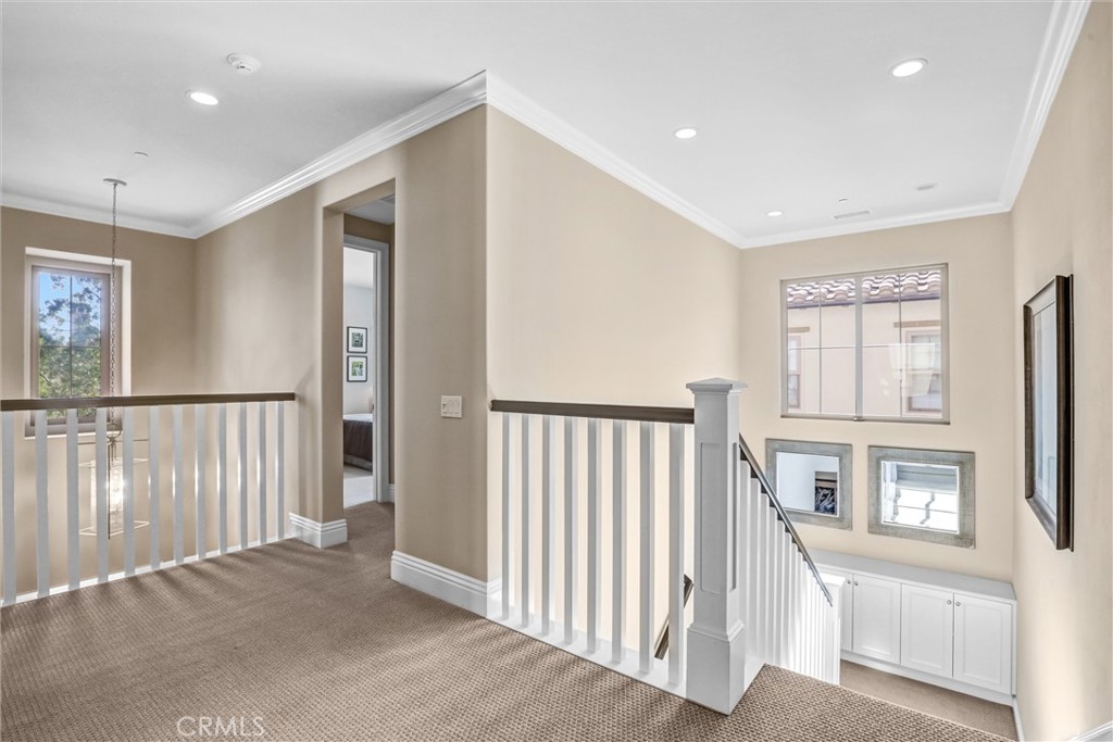 59 Rossmore Irvine, CA 92620 - Photo 18 of 45 a view of a hallway with windows