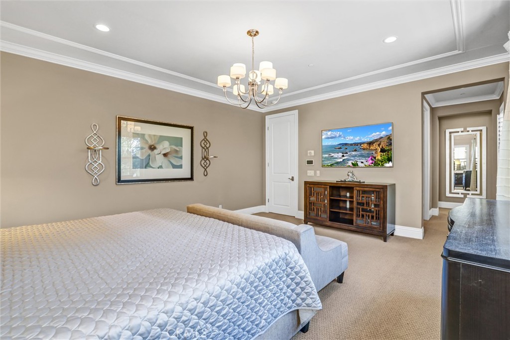 59 Rossmore Irvine, CA 92620 - Photo 23 of 45 a bedroom with a bed and a fireplace