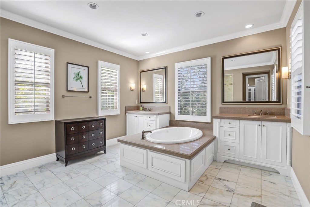 59 Rossmore Irvine, CA 92620 - Photo 24 of 45 a spacious bathroom with a sink double vanity and a tub