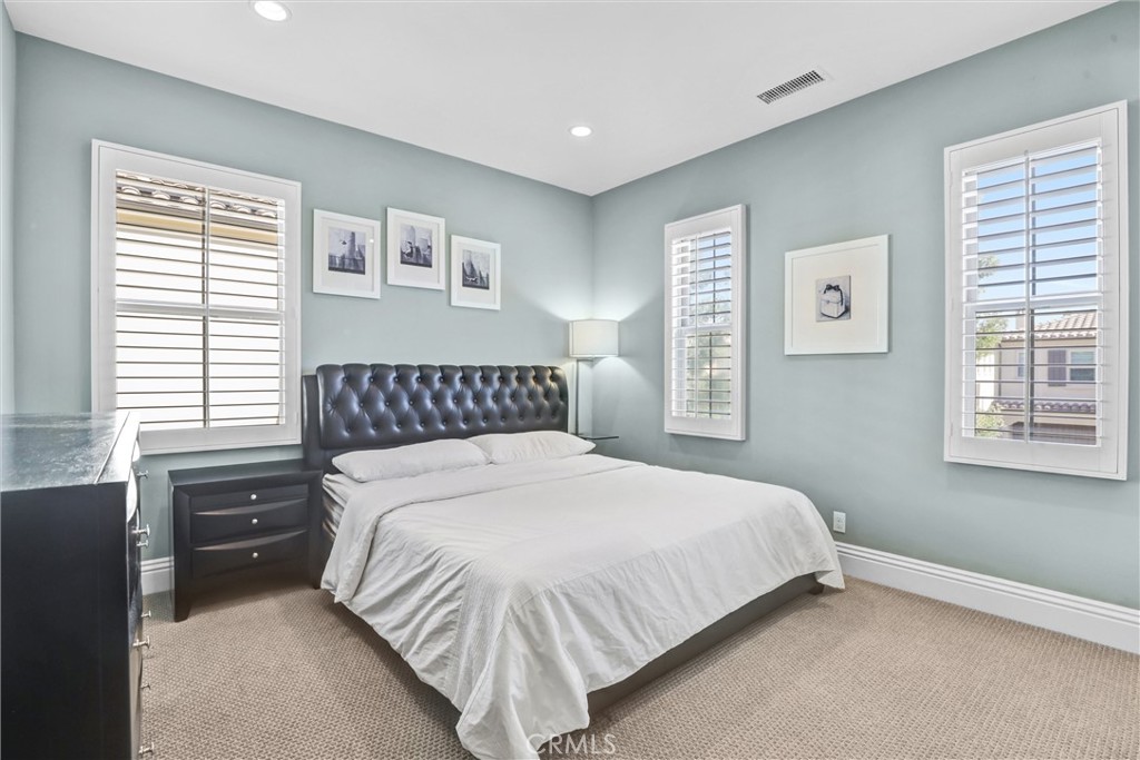 59 Rossmore Irvine, CA 92620 - Photo 27 of 45 a bedroom with a bed and a window