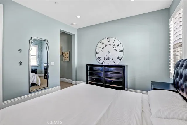 a bed room with a bed and a television