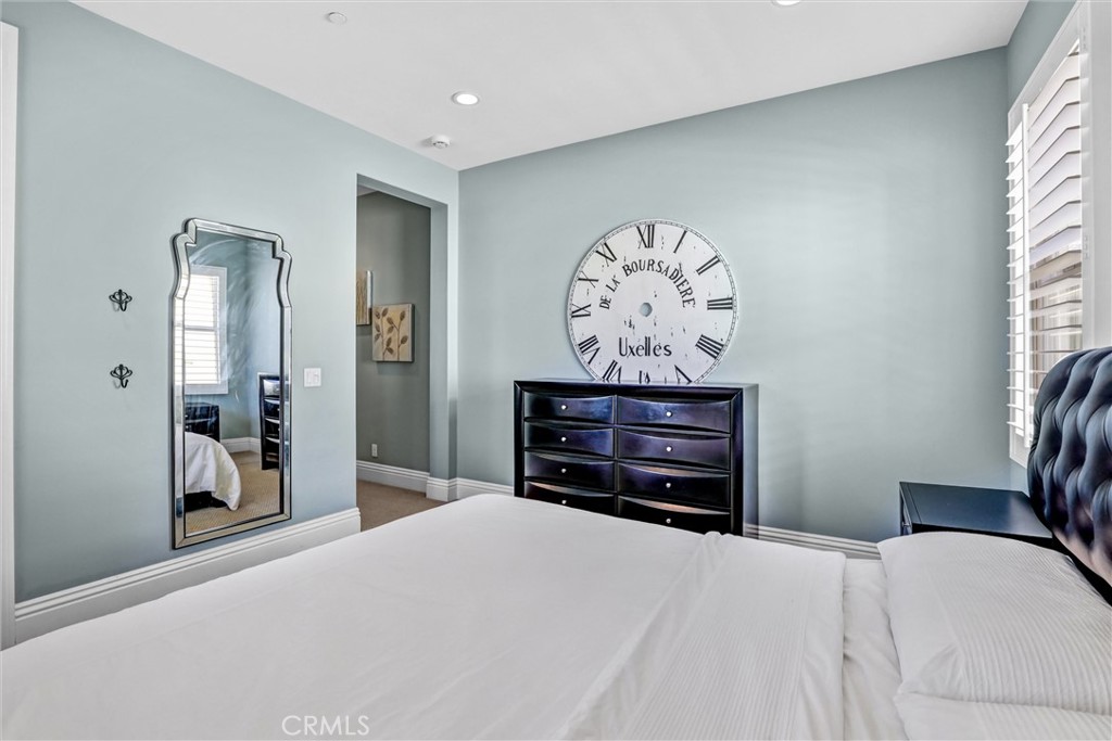 59 Rossmore Irvine, CA 92620 - Photo 28 of 45 a bed room with a bed and a television