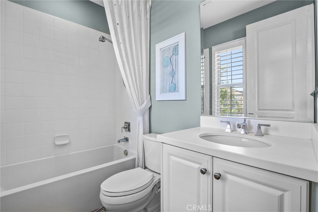 59 Rossmore Irvine, CA 92620 - Photo 29 of 45 a bathroom with a sink a toilet and shower
