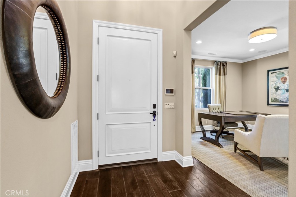 59 Rossmore Irvine, CA 92620 - Photo 3 of 45 a view of entryway with wooden floor and livingroom view