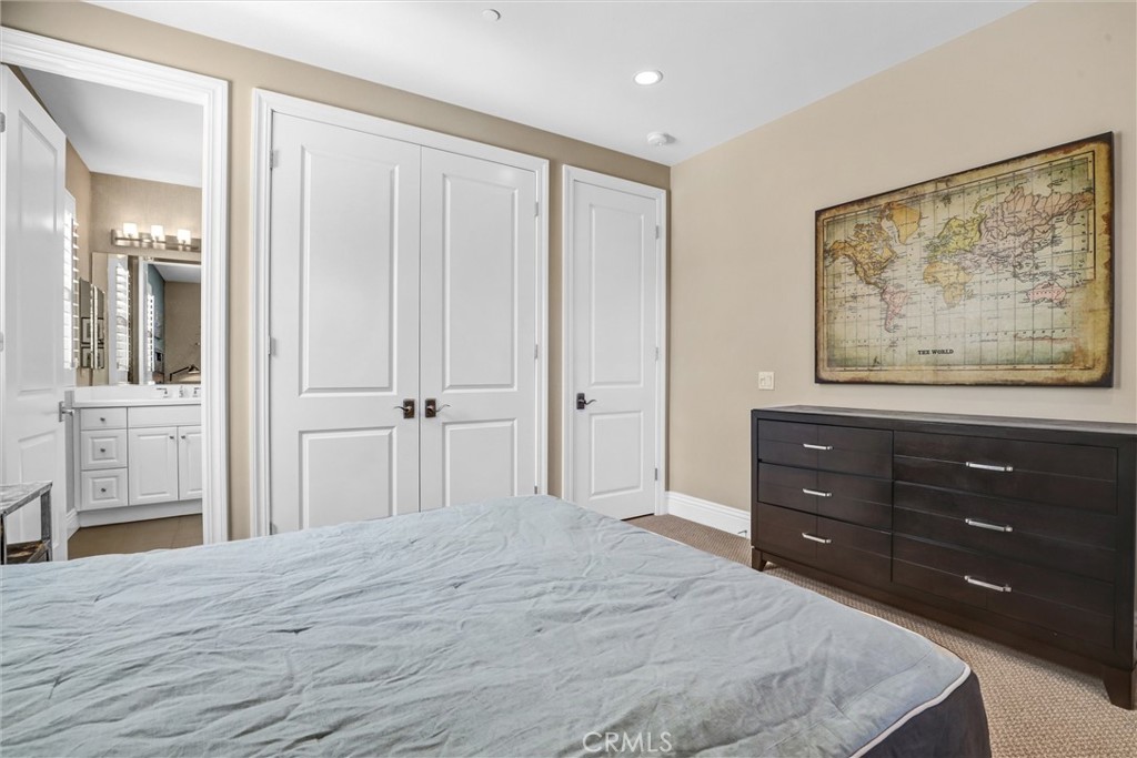 59 Rossmore Irvine, CA 92620 - Photo 31 of 45 a bedroom with a bed and a mirror