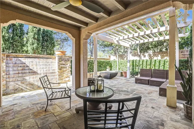 a view of a porch with furniture and wooden floor