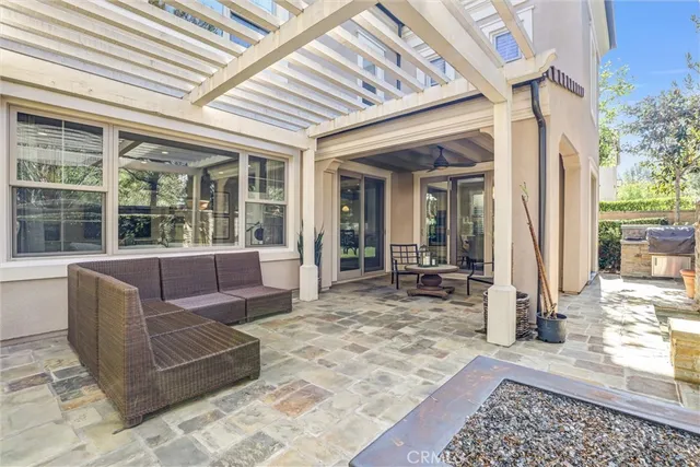a balcony with furniture and large window
