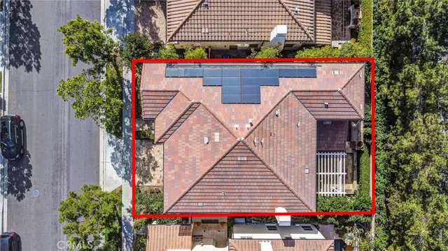 an aerial view of residential building and trees