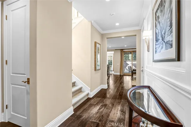a view of a hallway with furniture and staircase