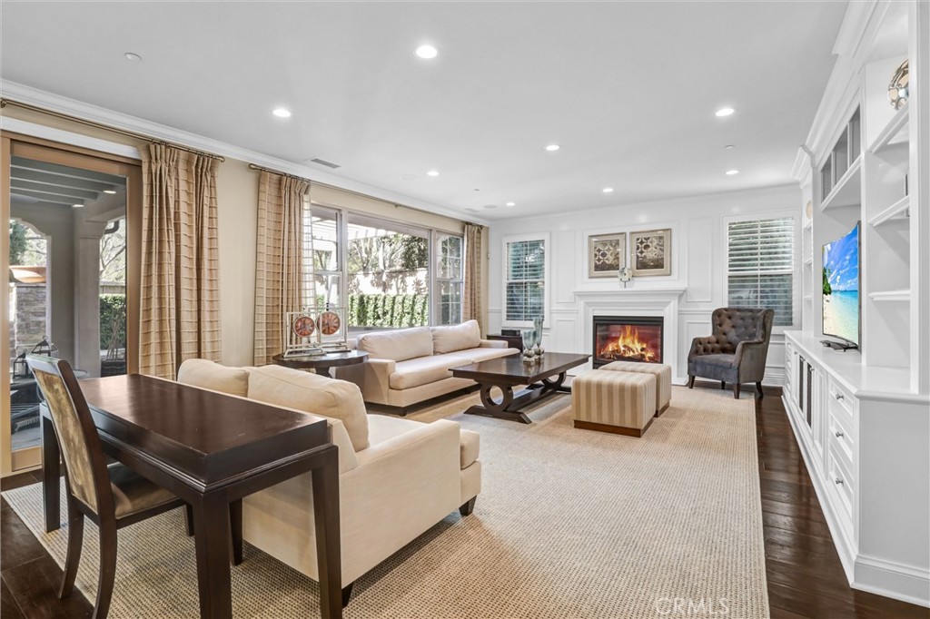 59 Rossmore Irvine, CA 92620 - Photo 8 of 45 a living room with furniture and a fireplace