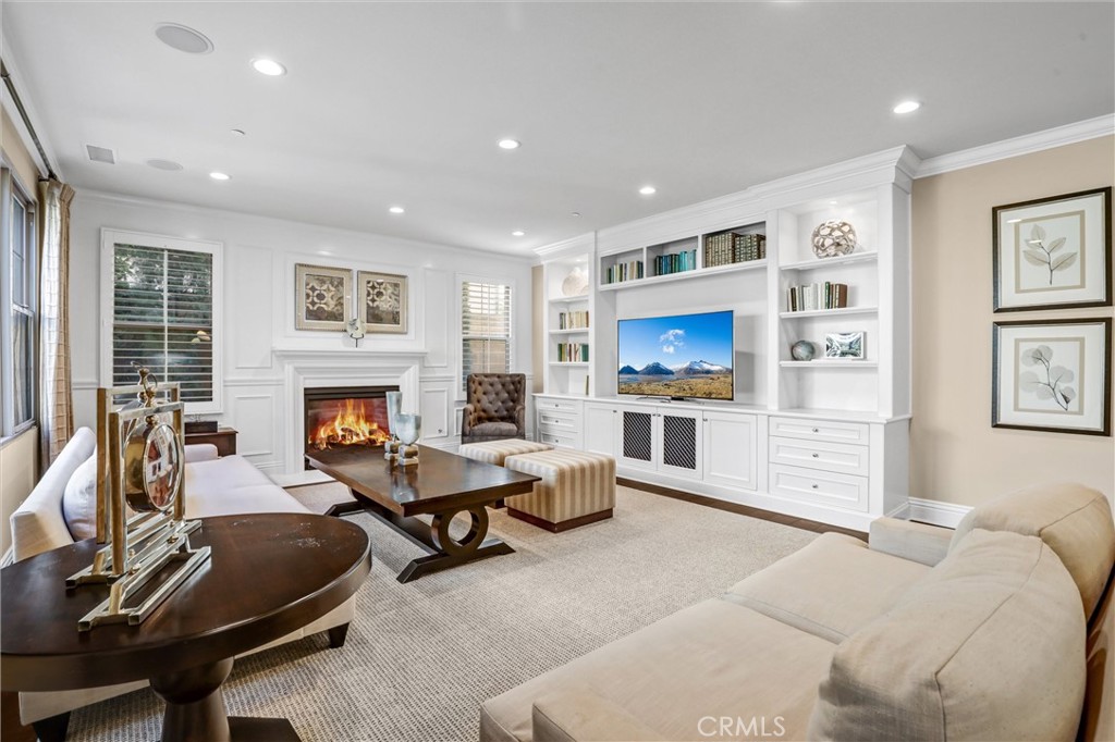 59 Rossmore Irvine, CA 92620 - Photo 9 of 45 a living room with furniture and a fireplace