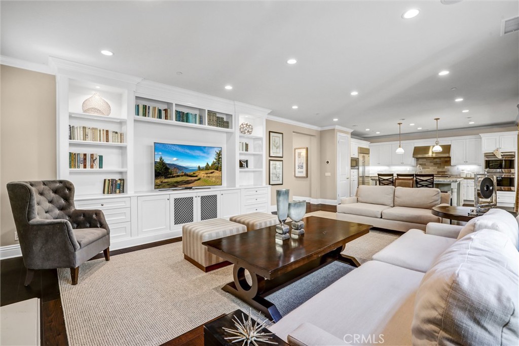 59 Rossmore Irvine, CA 92620 - Photo 10 of 45 a living room with furniture and a flat screen tv