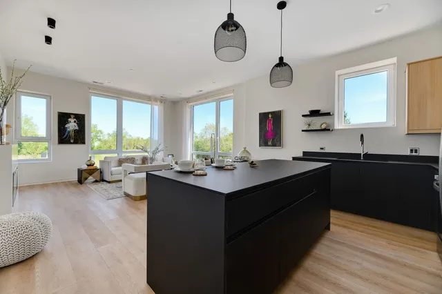 a kitchen with a sink cabinets and window