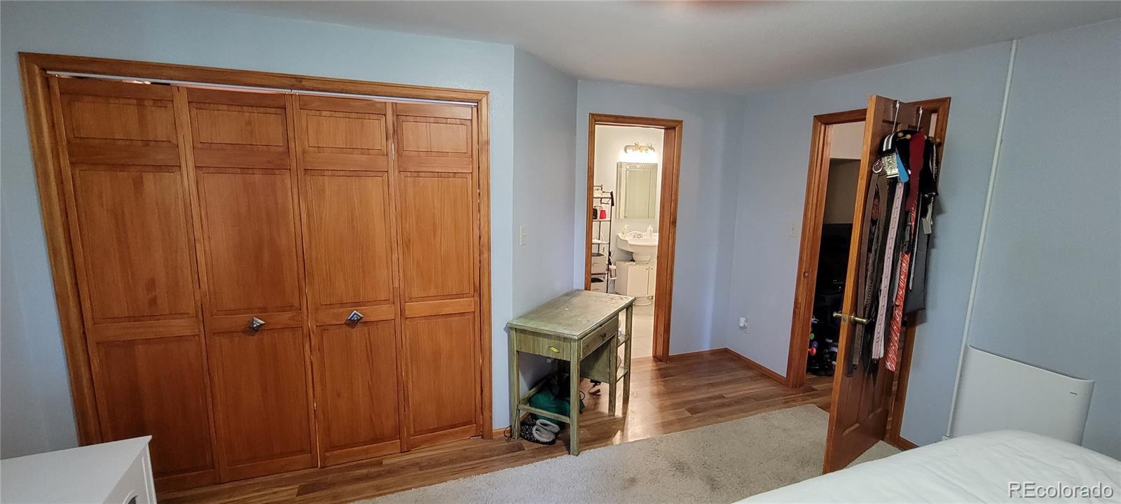 19533 Silver Ranch Road Conifer, CO 80433 - Photo 14 of 19 a view of front door with wooden floor