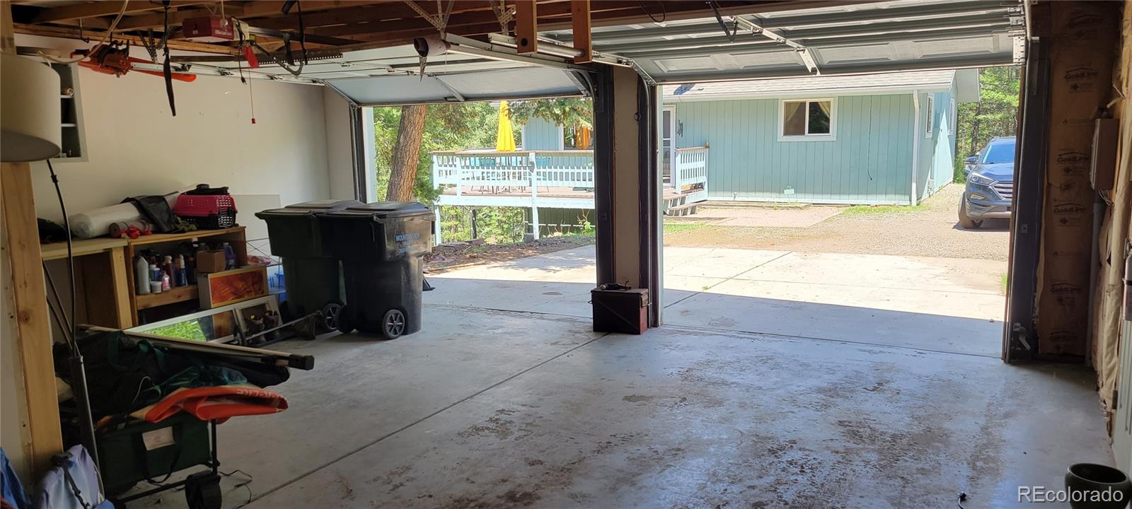 19533 Silver Ranch Road Conifer, CO 80433 - Photo 18 of 19 a view of a room with gym equipment and a large window