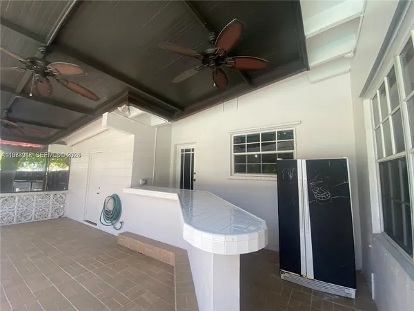 a view of a swimming pool with a yard
