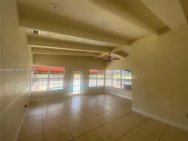 a view of an empty room with a window