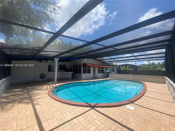 a view of a swimming pool with a chairs