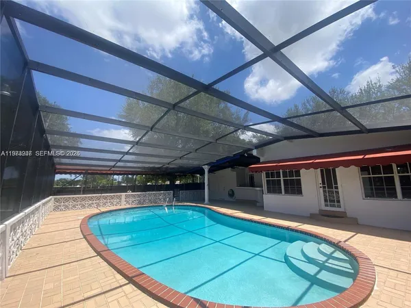 a view of a swimming pool with a patio