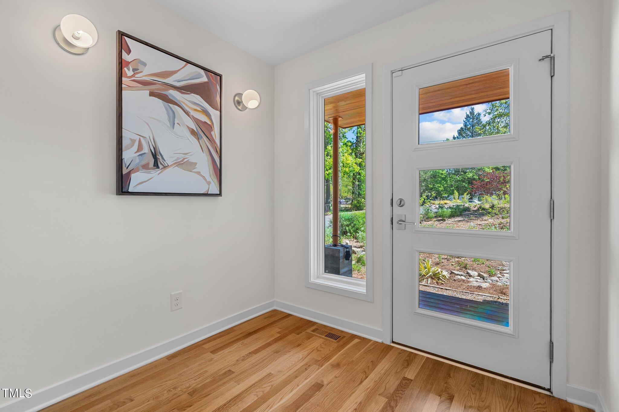 3546 Dixon Road Durham, NC 27707 - Photo 4 of 16 a view of room with window and wooden floor
