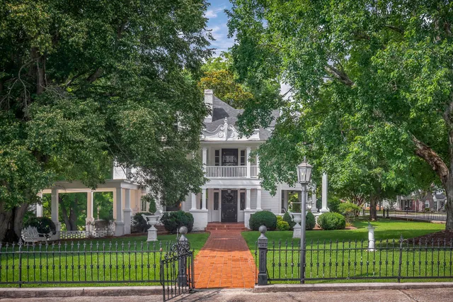 front view of a house with a garden