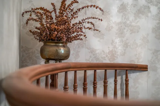 a view of a livingroom with furniture and a fireplace
