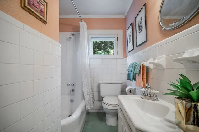 a bedroom with a bed and a fireplace