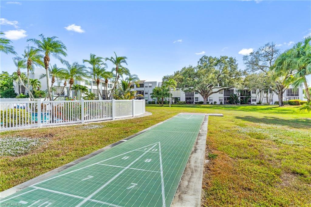 5959 Winkler Road, Unit 114 Fort Myers, FL 33919 - Photo 18 of 20 a view of a swimming pool with an outdoor space and seating area