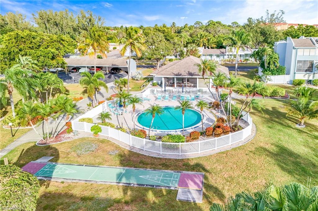 5959 Winkler Road, Unit 114 Fort Myers, FL 33919 - Photo 3 of 20 a view of a swimming pool with a yard