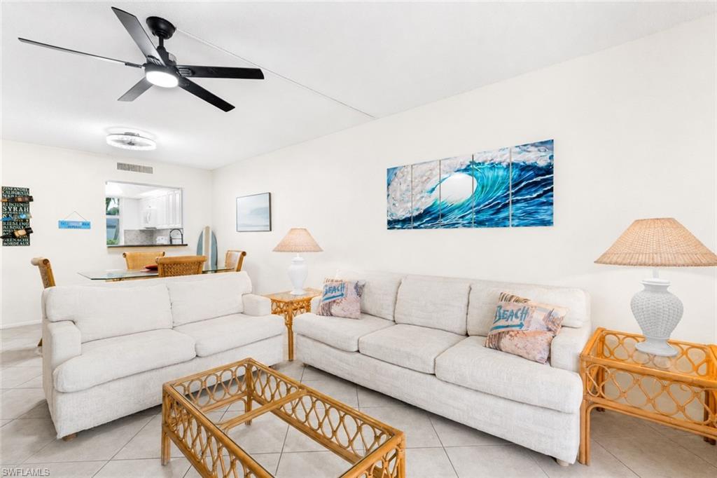 5959 Winkler Road, Unit 114 Fort Myers, FL 33919 - Photo 4 of 20 a living room with furniture and a ceiling fan
