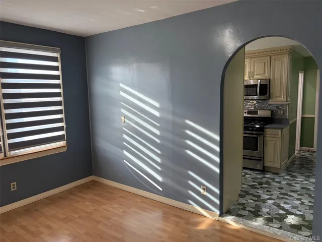 a kitchen with a sink stove and microwave