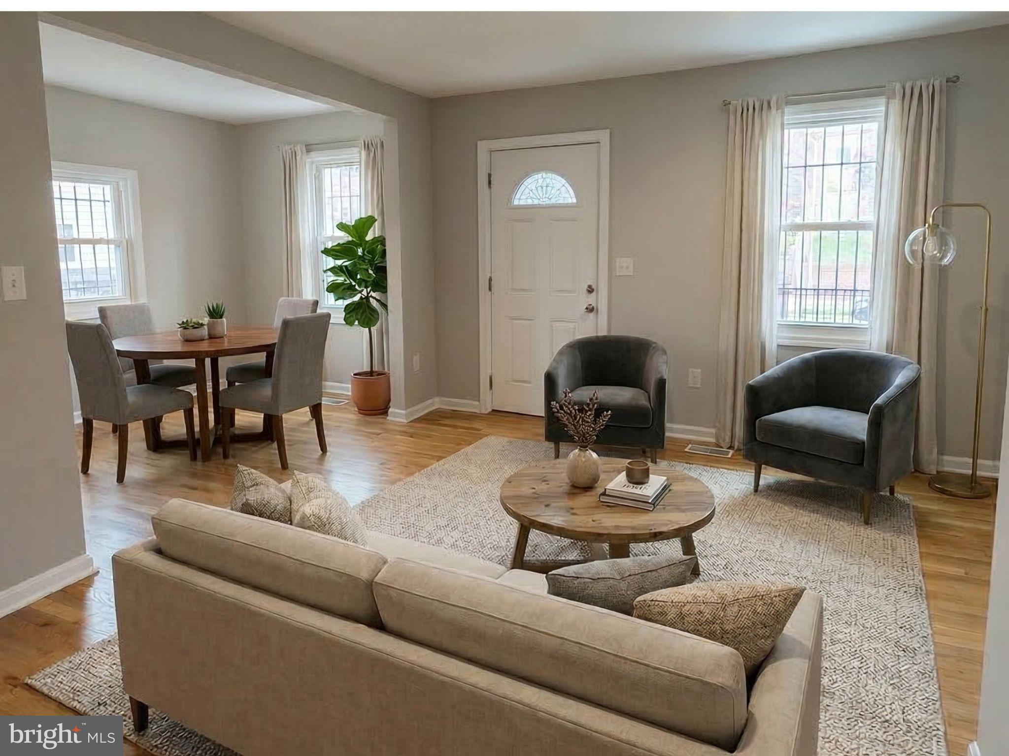 Virtually staged living & Din area w hardwood flrs