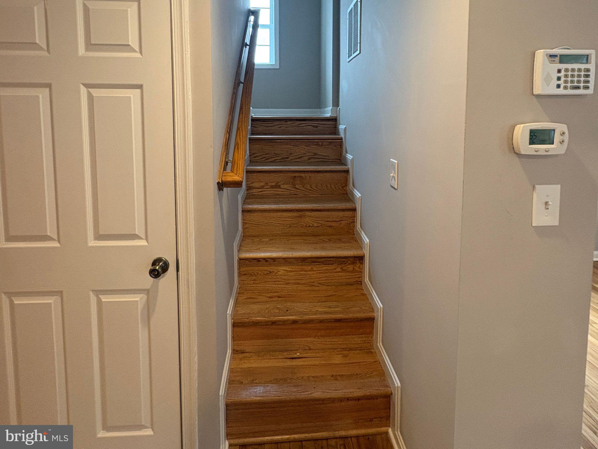 5126 Call Place Southeast Washington, DC 20019 - Photo 13 of 42 Hardwood staircase leading to upper level