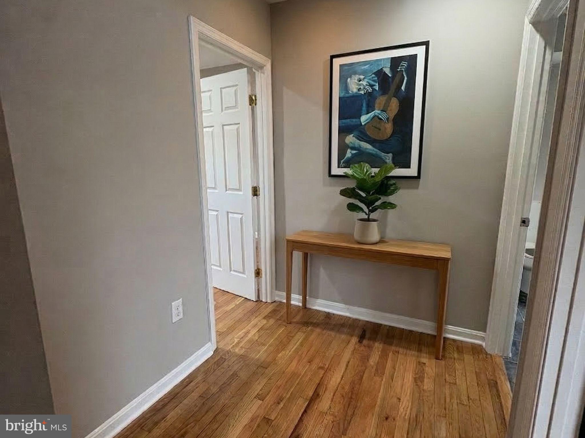 5126 Call Place Southeast Washington, DC 20019 - Photo 14 of 42 Virtually staged hallway with hardwood floors