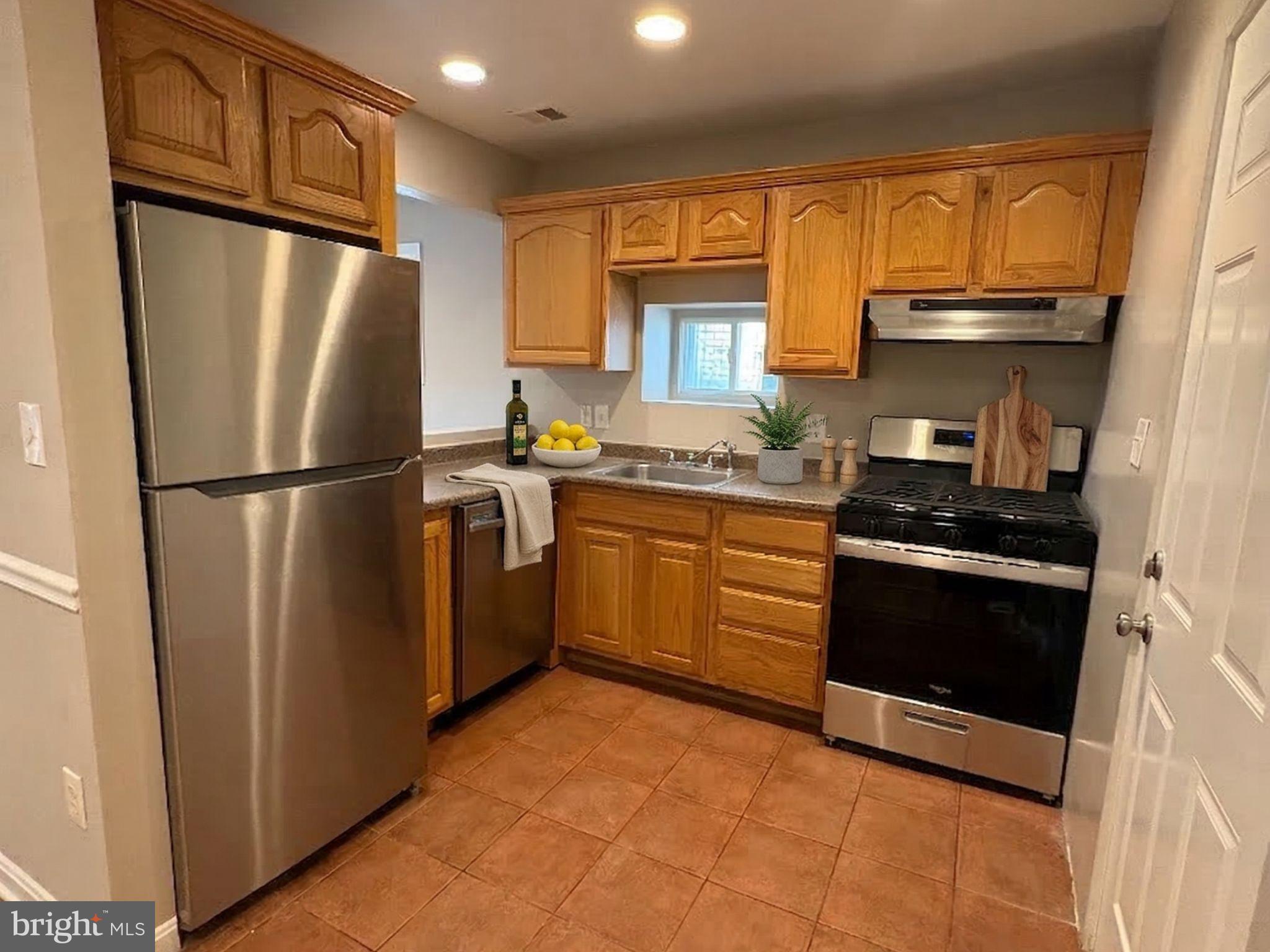 5126 Call Place Southeast Washington, DC 20019 - Photo 3 of 42 Charming kitchen with warm wood accents.