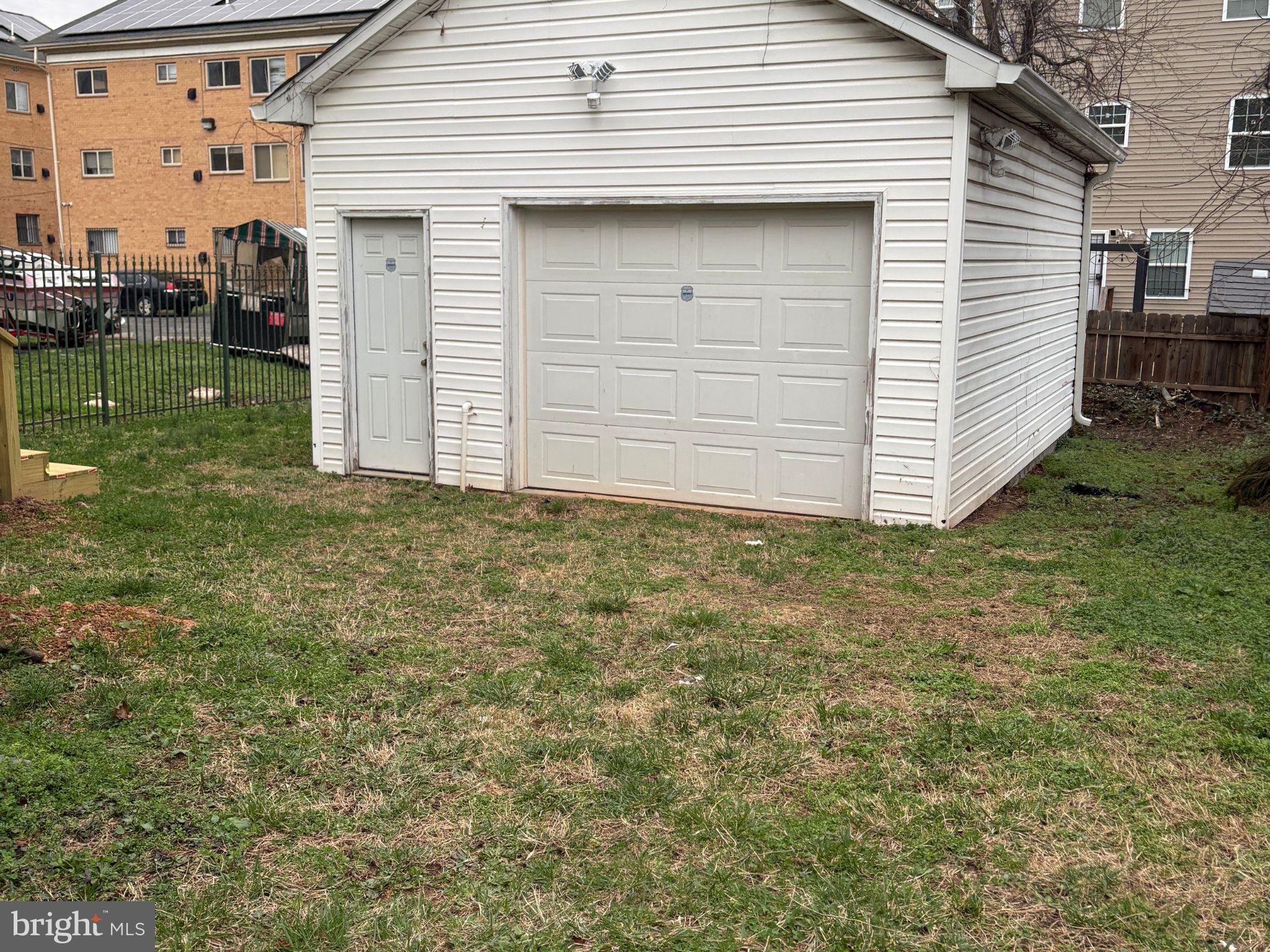5126 Call Place Southeast Washington, DC 20019 - Photo 42 of 42 Charming garage with spacious green yard.