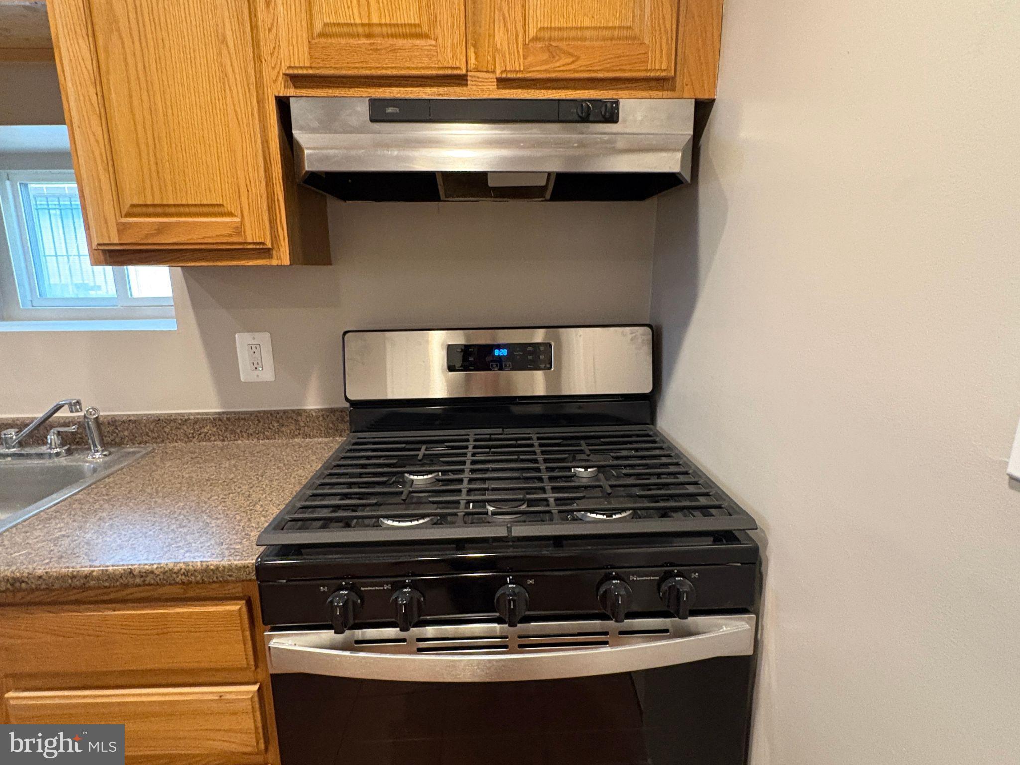 5126 Call Place Southeast Washington, DC 20019 - Photo 5 of 42 Kitchen with gas range and SS appliances
