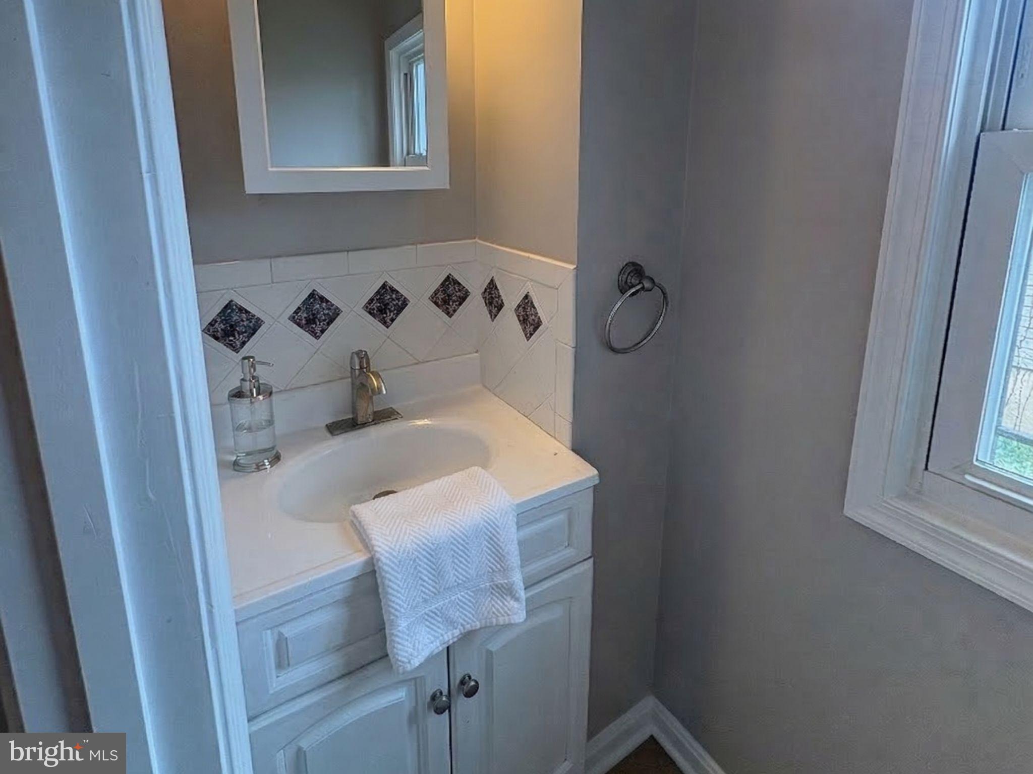 5126 Call Place Southeast Washington, DC 20019 - Photo 7 of 42 Half Bathroom with vanity