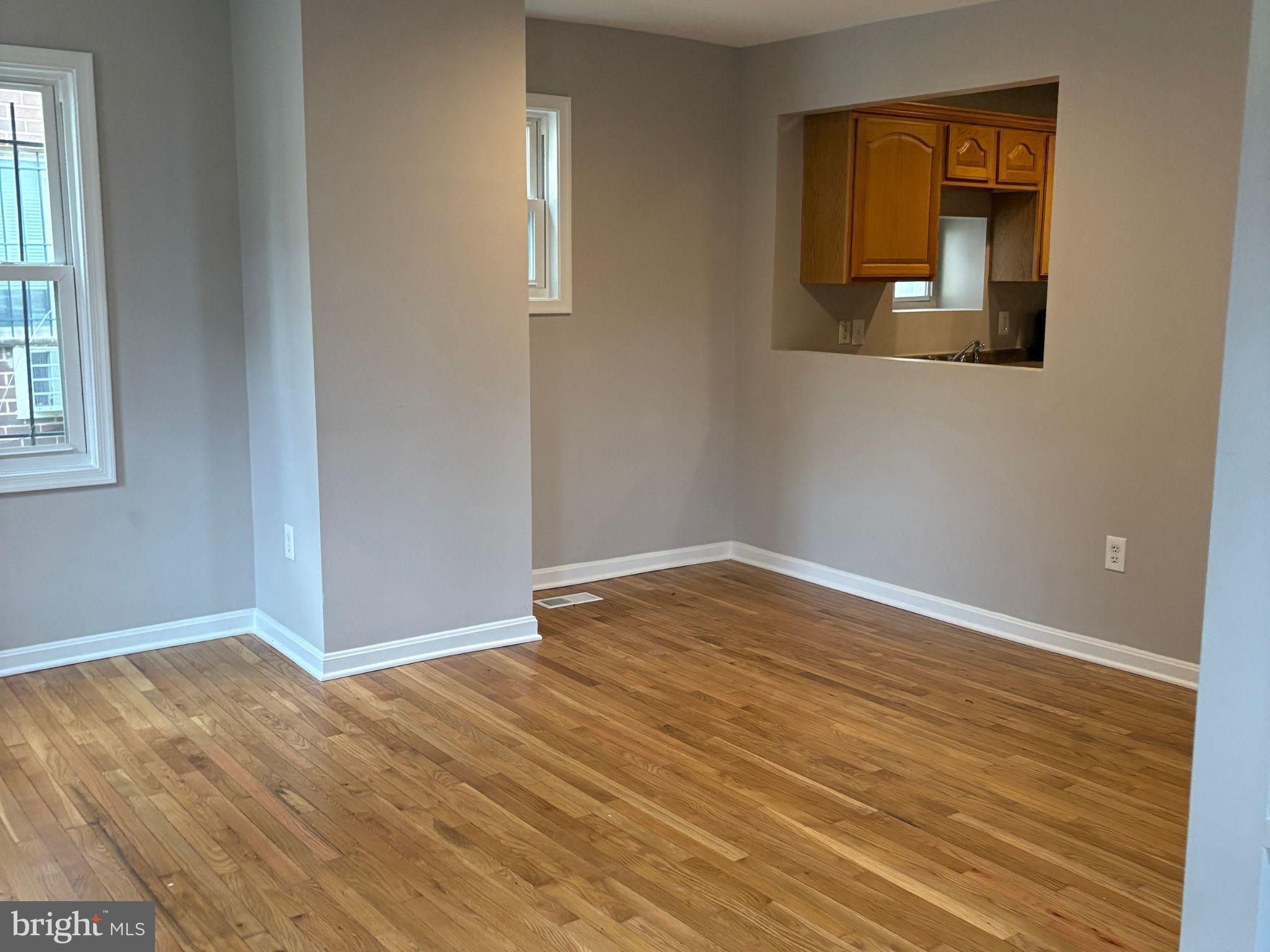 5126 Call Place Southeast Washington, DC 20019 - Photo 10 of 42 Bright, airy space with warm wood floors.