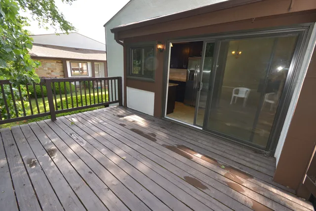 a view of backyard with glass door and glass door