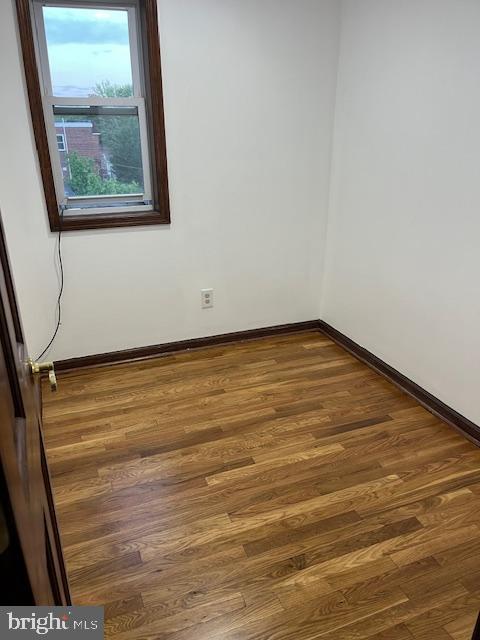 719 Taylor Drive Folcroft, PA 19032 - Photo 15 of 29 a view of an empty room with wooden floor and a window