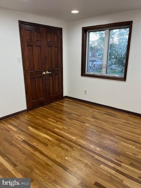 719 Taylor Drive Folcroft, PA 19032 - Photo 4 of 29 an empty room with wooden floor and cabinet