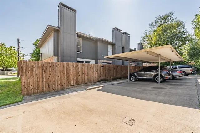 a car parked in front of a house