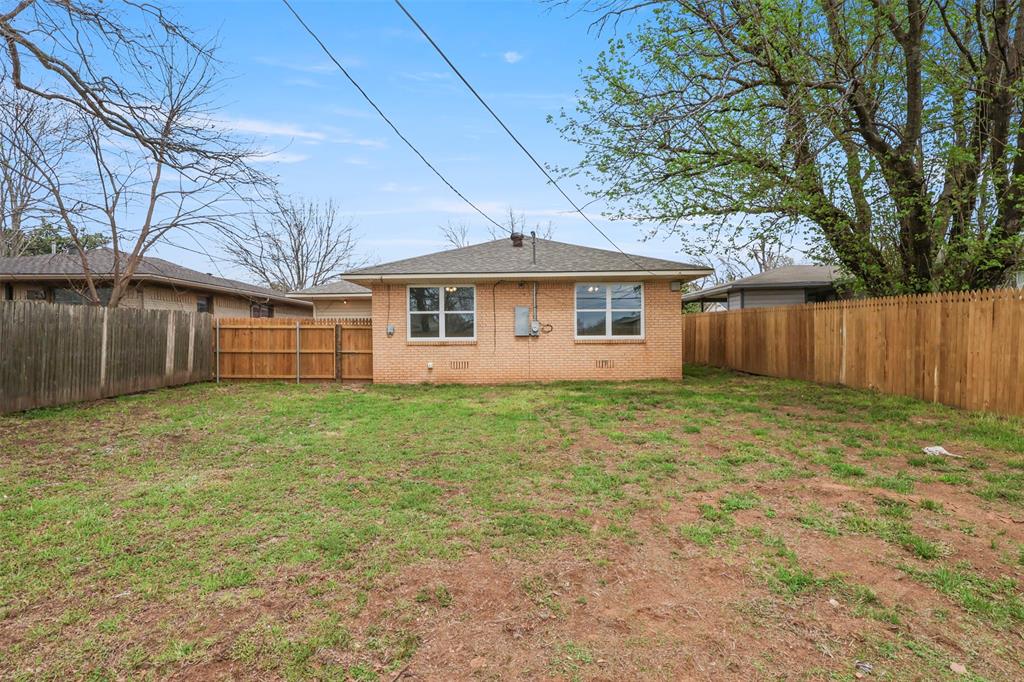 732 Bullock Street Denison, TX 75020 - Photo 4 of 29 a view of a house with a yard